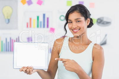 Casual brunette showing tablet computer
