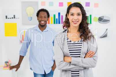 Young smiling business team looking at the camera