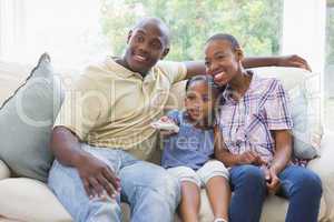 Happy smiling family watching television