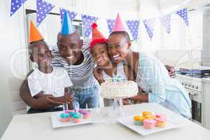 Happy family celebrating a birthday together