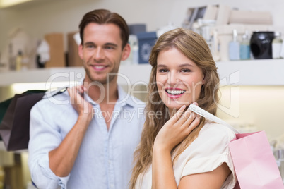 happy couple smiling in a perfurmery