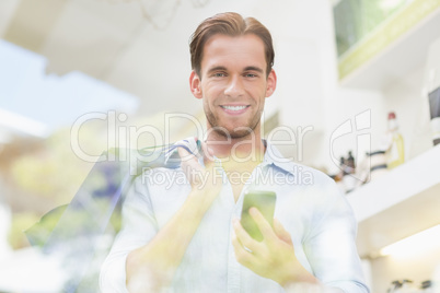 Portrait of a man looking at his phone