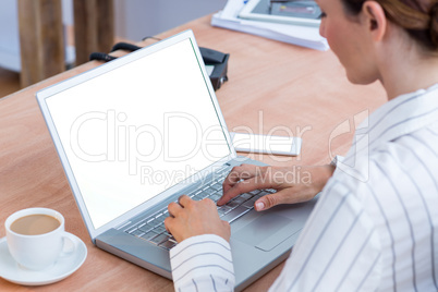 A businesswoman using her laptop