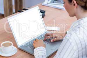 A businesswoman using her laptop