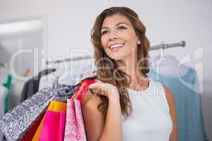 Smiling woman holding shopping bags