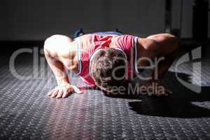 Muscular man doing push-ups