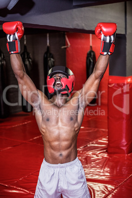 Young bodybuilder with helmet cheering