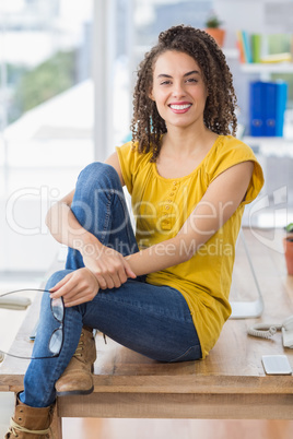 Smiling young businesswoman looking at the camera