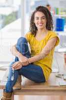 Smiling young businesswoman looking at the camera