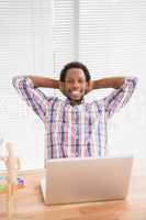 Young businessman relaxing at his desk