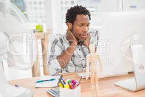 Young businessman looking at his computer screen