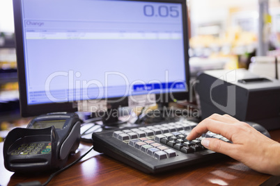 Hand of woman using computer