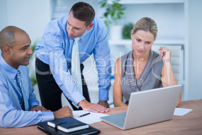 Business partners working on laptop