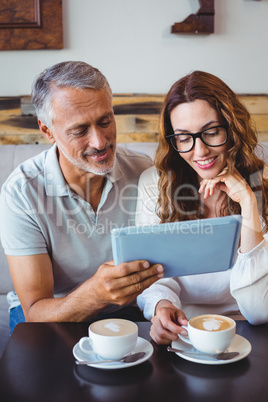 Couple using digital tablet