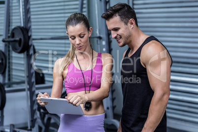 Female coach showing results to an athlete