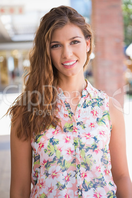 Portrait of smiling woman wearing blouse with floral pattern