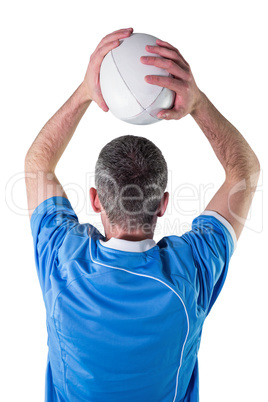 Rugby player about to throw a rugby ball