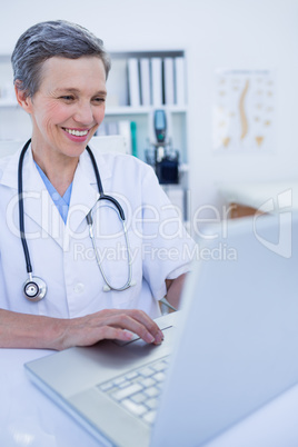 Female doctor using her laptop computer