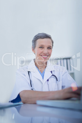 Happy female doctor looking at camera