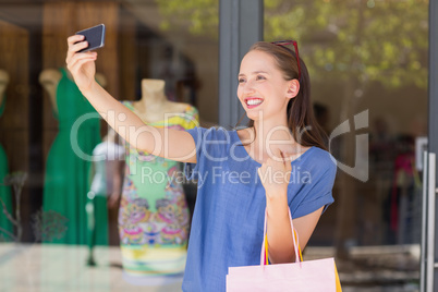 Happy woman taking a selfie