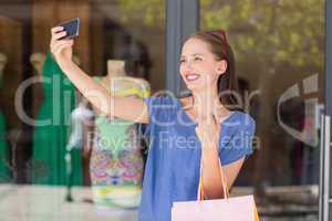 Happy woman taking a selfie