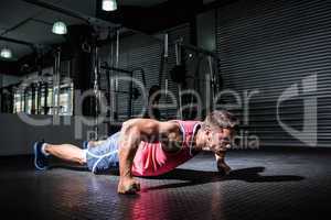 Muscular man doing push-ups