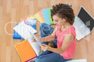 Young creative businesswoman watching a tablet