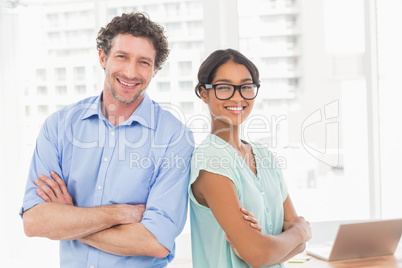 Casual business partners smiling at camera