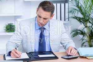 Professional businessman writing on his notebook