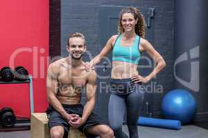 Standing and sitting muscular couple