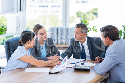 Business people speaking together during meeting