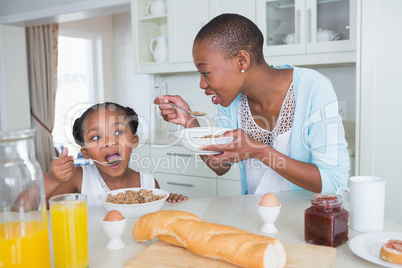 Mother and duaghter eating together