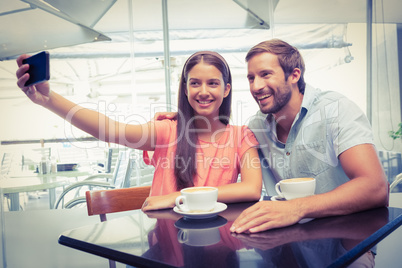 Young happy couple making a selfie