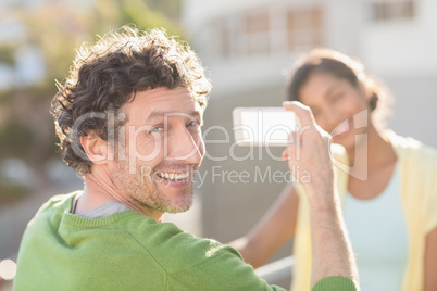 couple taking photos of themselves