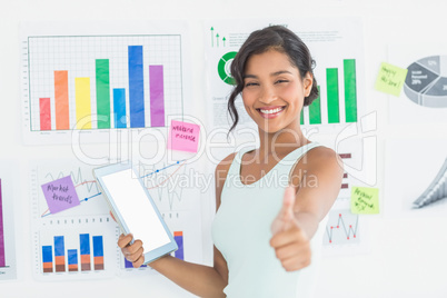 Casual brunette showing tablet computer