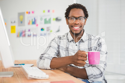 Young businessman holding a mug