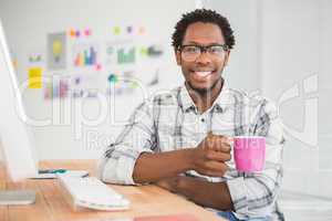 Young businessman holding a mug