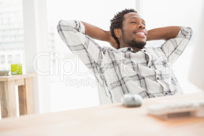 Young businessman sitting at his desk