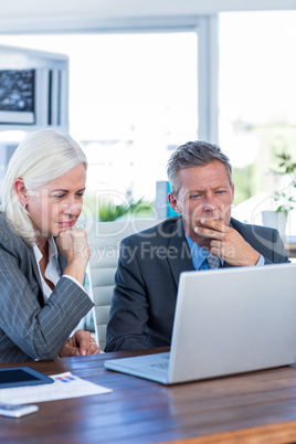 Business people working on laptop computer