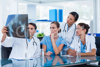 Team of doctors looking at xray