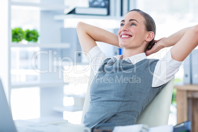 Businesswoman relaxing in a swivel chair