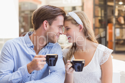 Cute couple drinking a coffee together