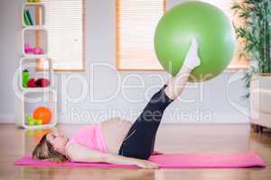 Pregnant woman doing exercise with exercise ball