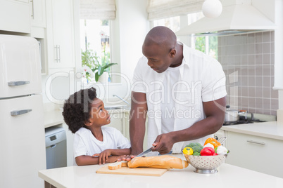 Little boy cooking with his father