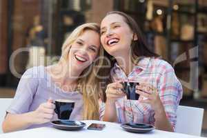 Happy women friends talking and laughing together