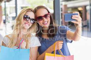 Happy smiling friends taking a selfie
