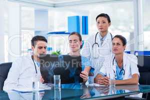 Team of doctors looking at xray