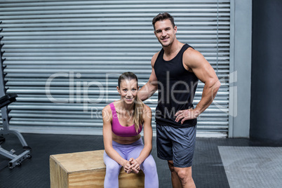 Standing and sitting muscular couple