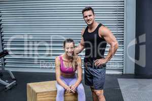 Standing and sitting muscular couple