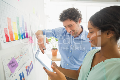 Business team analyzing charts together